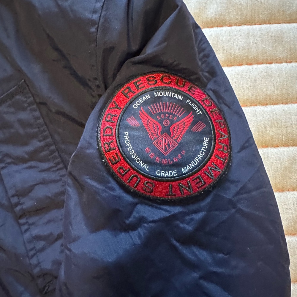 Superdry Rescue Navy Parka. Missing fur on the hood.